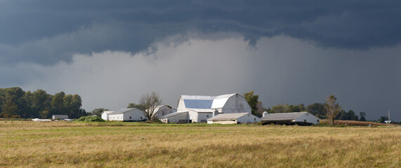 Dark, Stormy Skies Over An Amish Family Farm in Ohio's Amish Country