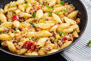 Conchiglie pasta. Italian pasta shells with minced meat, zucchini, tomato and sweet peppers.