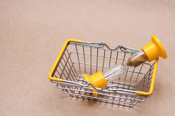 An hourglass in the shopping basket. concept of time.