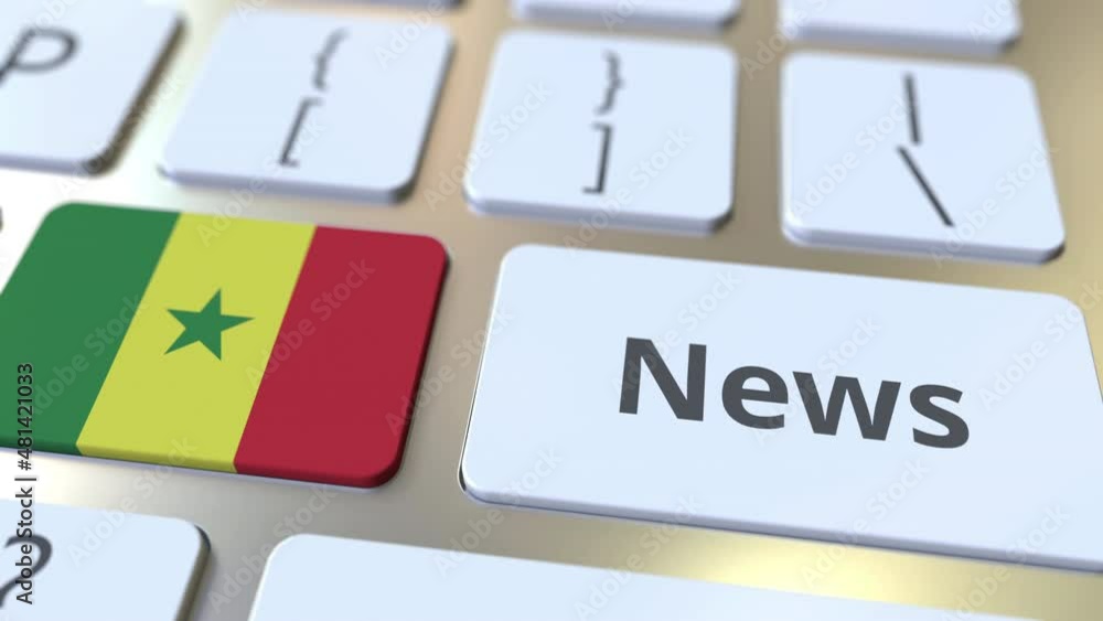 Aufkleber news text and flag of senegal on the keys of a computer keyboard. national online media related conc
