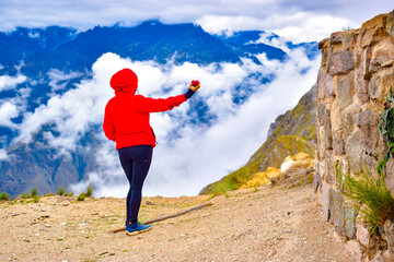 woman eating fruit in mountain