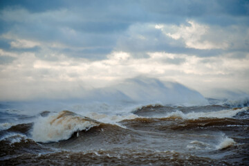 windy storm on a baltic sea at winter with clouds in the sky