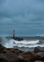 lighthouse by the sea on a windy cloudy day