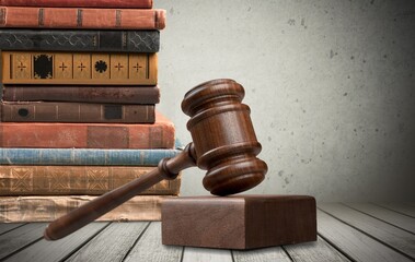 Legal Law and Justice concept, law book with a wooden judges gavel on table