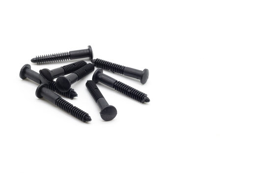 black plastic screws on a white background
