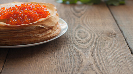 A stack of pancakes in a white plate