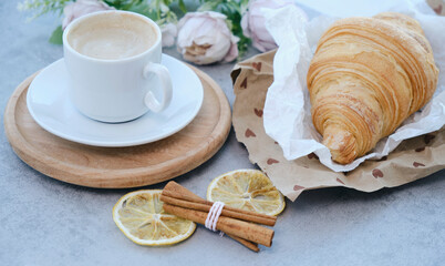 Obraz na płótnie Canvas French Breakfast with Croissants and Coffee on wooden background