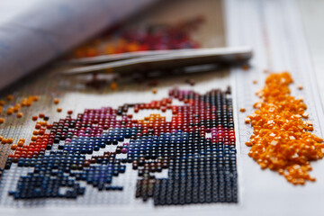 Multicolored Diamond Strases and Manual Fixer for handmade process of creation of diamond painting...