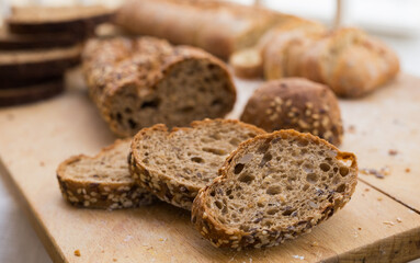 fresh loaf of bread on wooden board