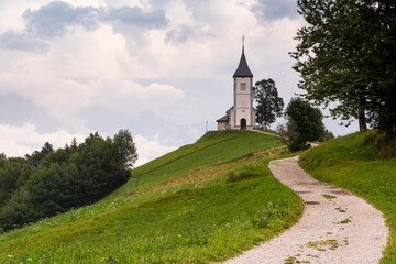 Fototapeta na wymiar Church Jamnik in Slovenia on Green Hill in Slovenia