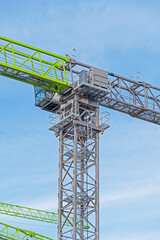 construction crane at blue sky as background