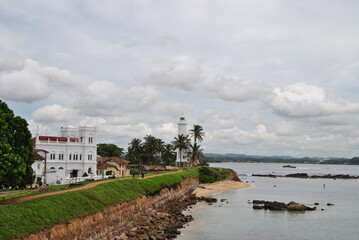Fototapeta na wymiar Lighthouse in Sri Lanka. Halle. Lighthouse on the island. Palm Island. A defensive fort.
