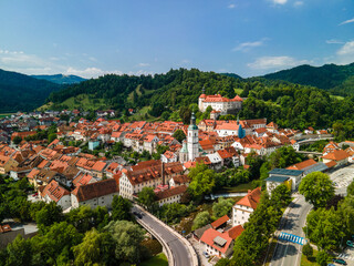 Skofja Loka in Slovenia. Medieval Old Town, Bell Tower and Castle. Drone View