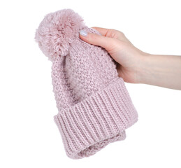 Pink warm hat for girls in hand on white background isolation