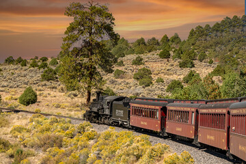 A steam engine locomotive and passenger cars on the Cumbris & Toltec scenic railroad near Antonio colorado