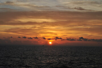 Naklejka na ściany i meble Sunset in Sri Lanka. Golden sunset on the sea. Ships at sunset. Sunset on the ocean. Sunrise.