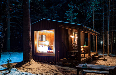 wooden house for relaxing in the forest for maximum immersion in nature, panoramic windows and...