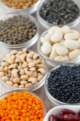 Lentils, legumes and beans on white surface