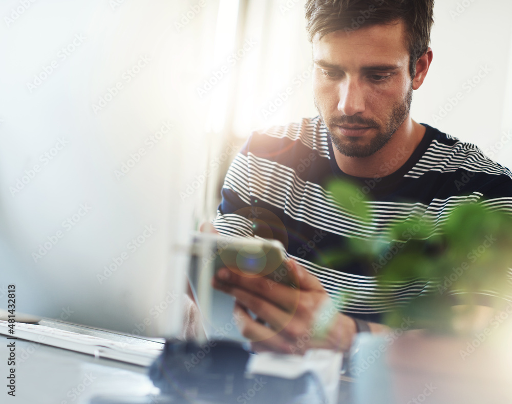 Poster always designing, always creating. shot of a designer using his digital tablet at his desk.