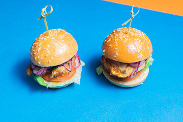 two burgers, two mini burgers, a burger for catering