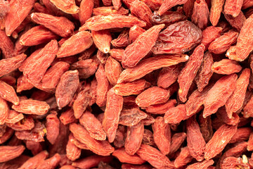 Dried organic goji berries, macro, top view.