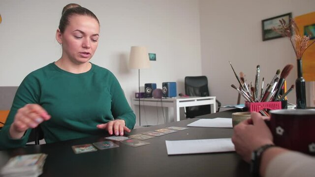 Oral conversation of a woman at the table. She tells the specialist about psychological problems. Focus of attention.