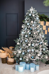 Living room with christmas tree and present boxes