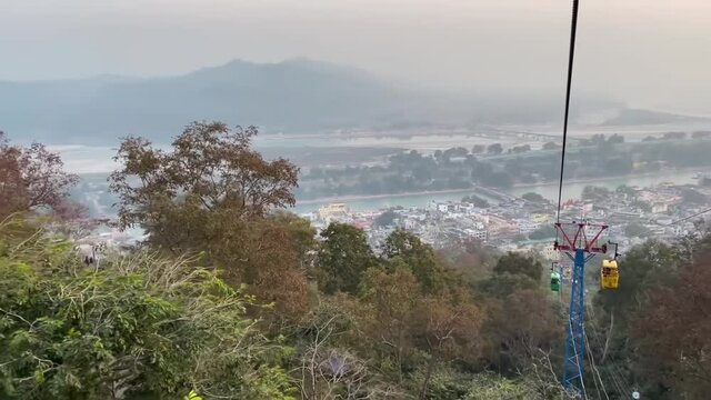 Travelling via rope-way trolley in the holy place of haridwar.
