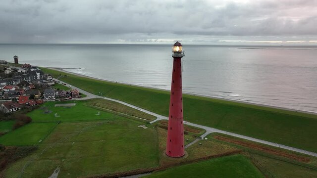 Lighthouse tower Lange Jaap in Den Helder drone aerial footage 5K along the sea near the island of Texel in North Holland, The Netherlands.