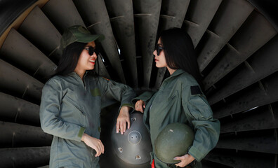 Portrait femaile soldier walk at front of jet enginer of air plane