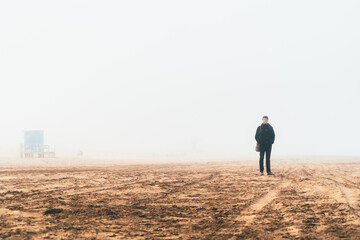 person in the misty beach