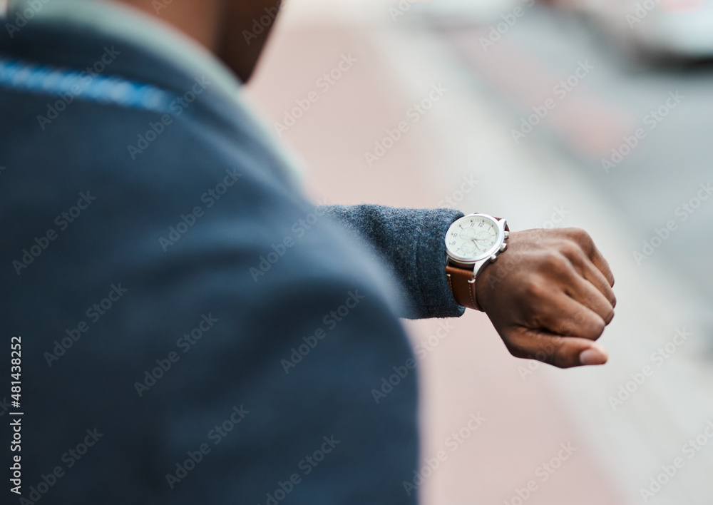 Poster never underestimate the value of time. cropped shot of a businessman checking the time against an ur