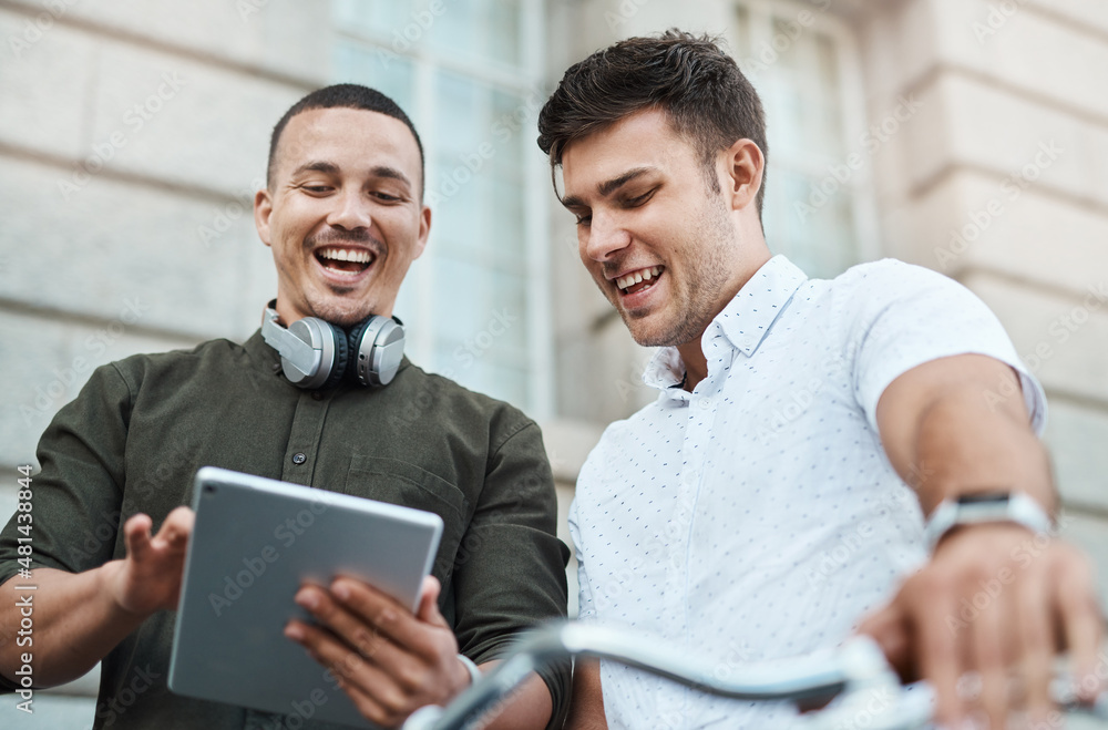 Aufkleber how millennials make things happen. shot of two young businessmen using a digital tablet together wh