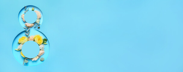Rose flowers visible through cut blue paper in shape of figure 8. International Women's Day...