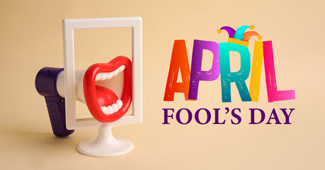 Funny megaphone on color background. April Fool's Day celebration