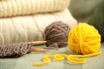 Balls of thread and knitted things close up