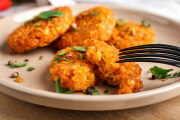 Plate with tasty lentil cutlets on table, closeup