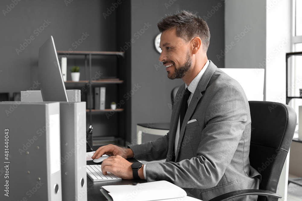 Aufkleber handsome businessman working with computer at table in office