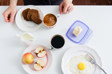 Healthy breakfast: fried egg and rye bread.