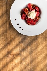 Tasty fresh steak with baked vegetables on white plate. Meat steak medium rare roasted