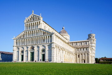 Fototapeta na wymiar Piazza dei Miracoli - Pisa, Italy, January 2021: Cathedral medieval Roman Catholic Assumption of the Virgin Mary in Piazza dei Miracoli and Pisa leaning tower
