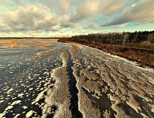 Panorama.View from the top of the backwaters of the Narew river ice-bound in winter.