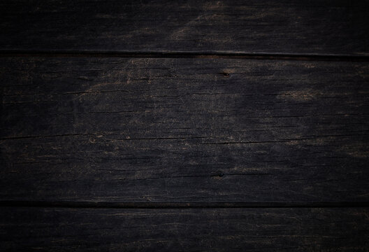 Old wooden table texture background that has natural cracks.