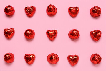 Heart shaped candies on pink background. St. Valentine's Day