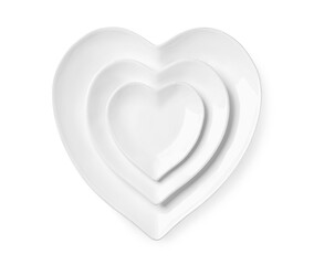 Beautiful heart-shaped plates on white background