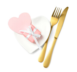 Beautiful heart-shaped plate and cutlery on white background