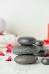 Fototapeta na wymiar Beautiful spa stones for Valentine's Day celebration on light background, closeup