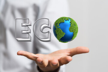 Eco word on the background of green leaves of carrots. plantation