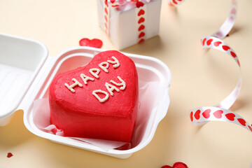 Plastic lunch box with tasty bento cake on beige background, closeup