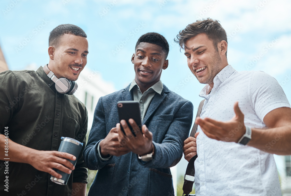 Poster making moves all over the city. shot of a group of businesspeople using a smartphone together agains